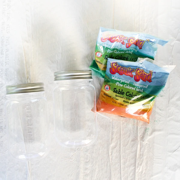 This Halloween craft project is so fun!  Create mason jar mummies candleholders for Halloween!